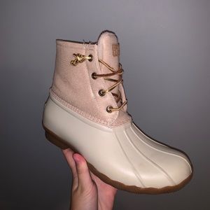 Rose gold sperry duck boots.